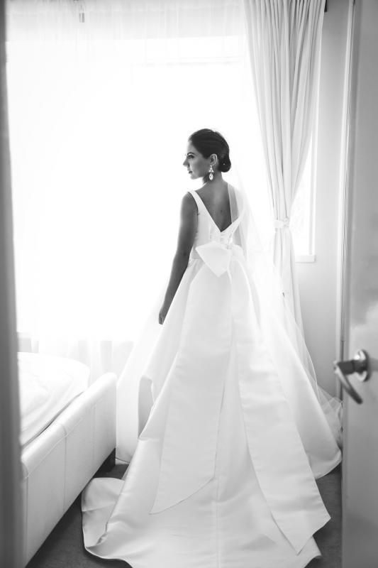 Real bride Lina wore the Bespoke Taryn Camille wedding dress by Karen Willis Holmes.
