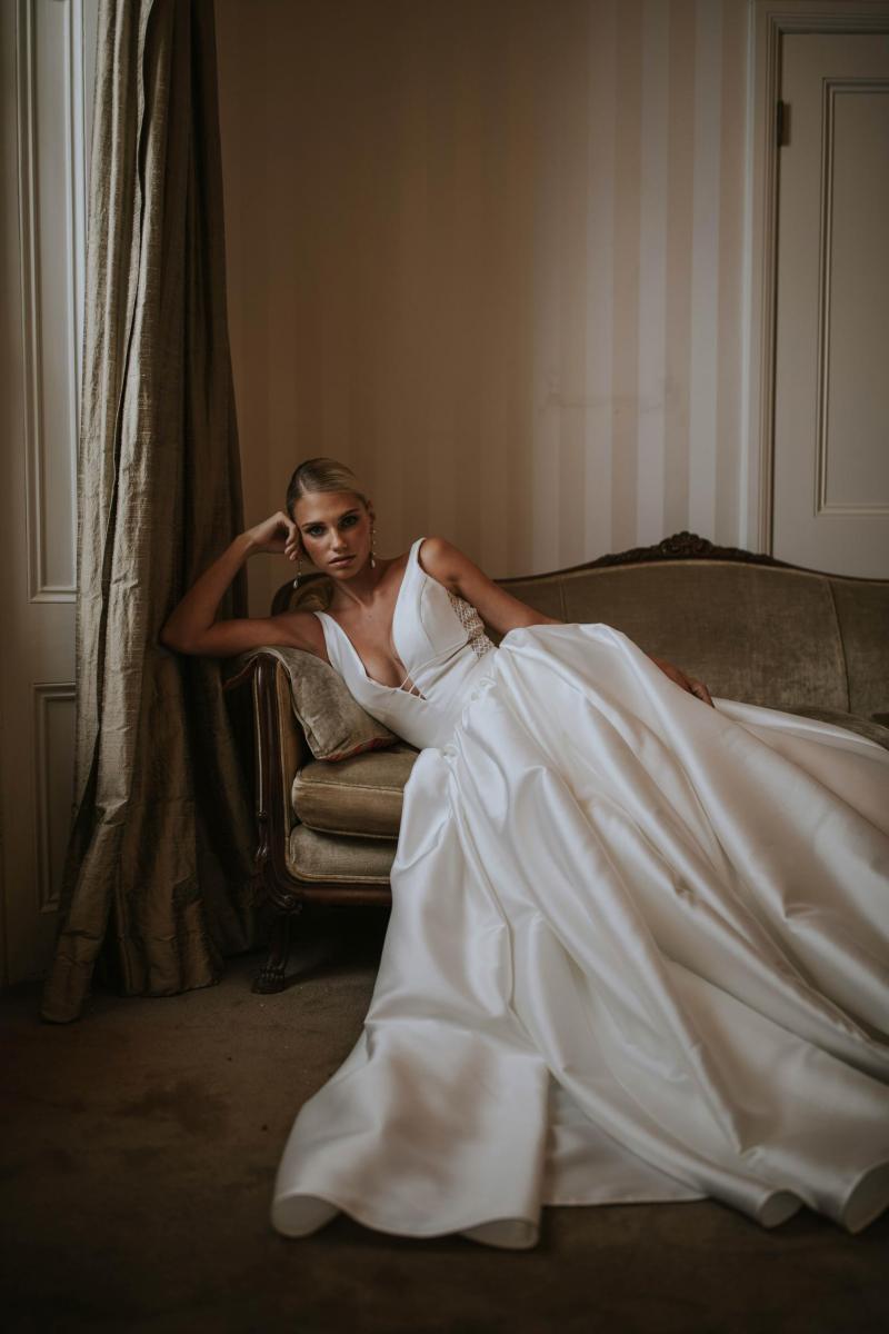 The Shelly Julianne gown by Karen Willis Holmes, nontraditional plunging neckline ball gown wedding dress with pockets.