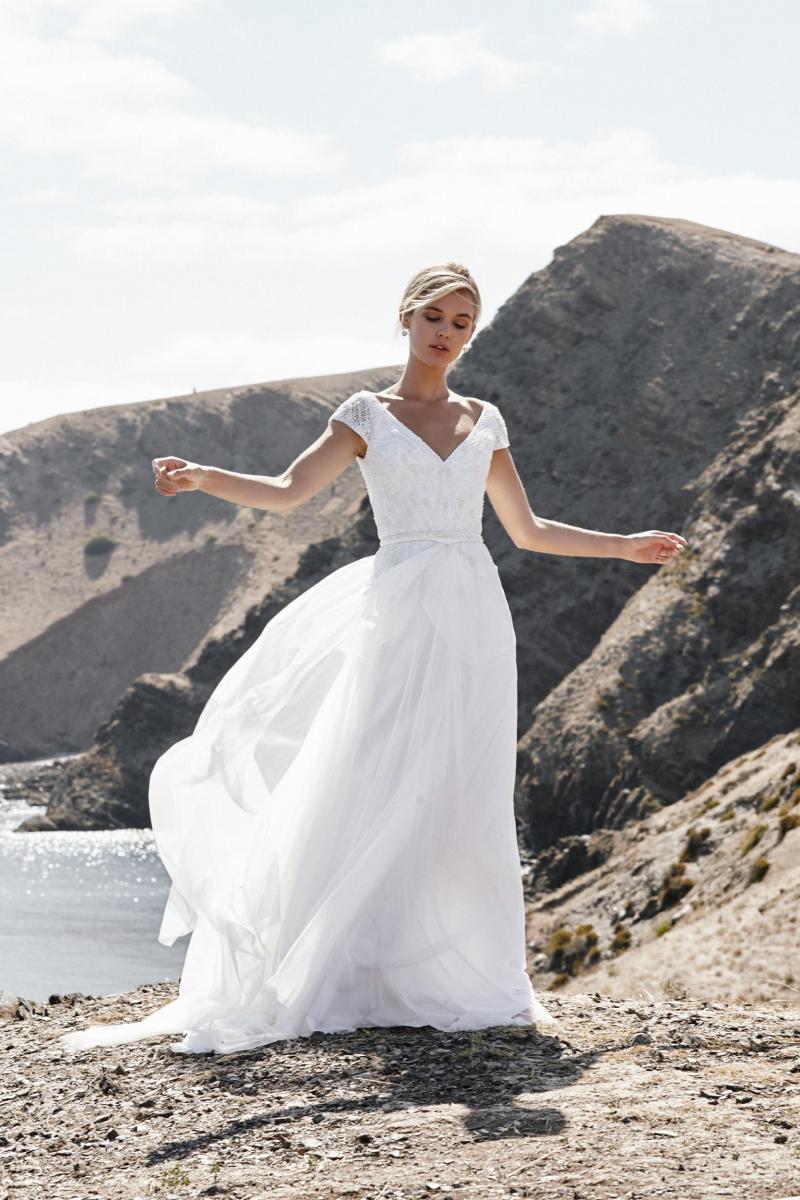 The Valeria gown by Karen Willis Holmes, a-line cap sleeve beaded wedding dress.