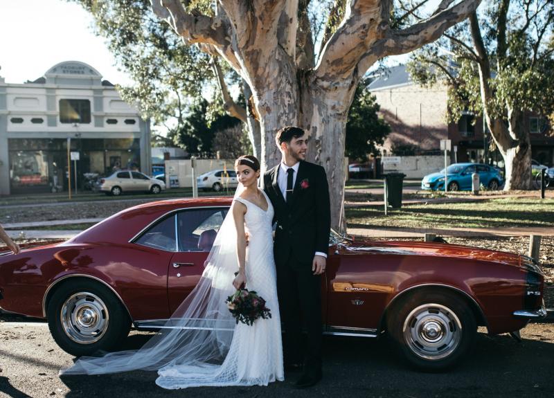 Real bride Victoria wore the Luxe Whitney wedding dress by Karen Willis Holmes.