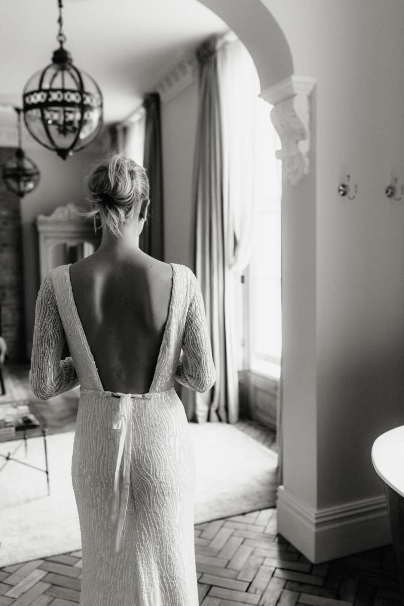 The Margareta gown by Karen Willis Holmes, backless beaded wedding dress.