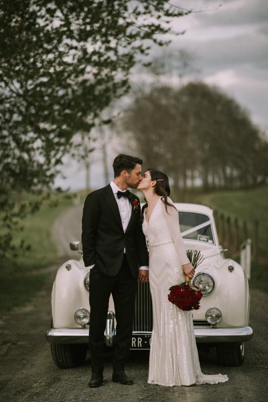 Real bride Louise wore the Luxe Cassie wedding dress by Karen Willis Holmes.