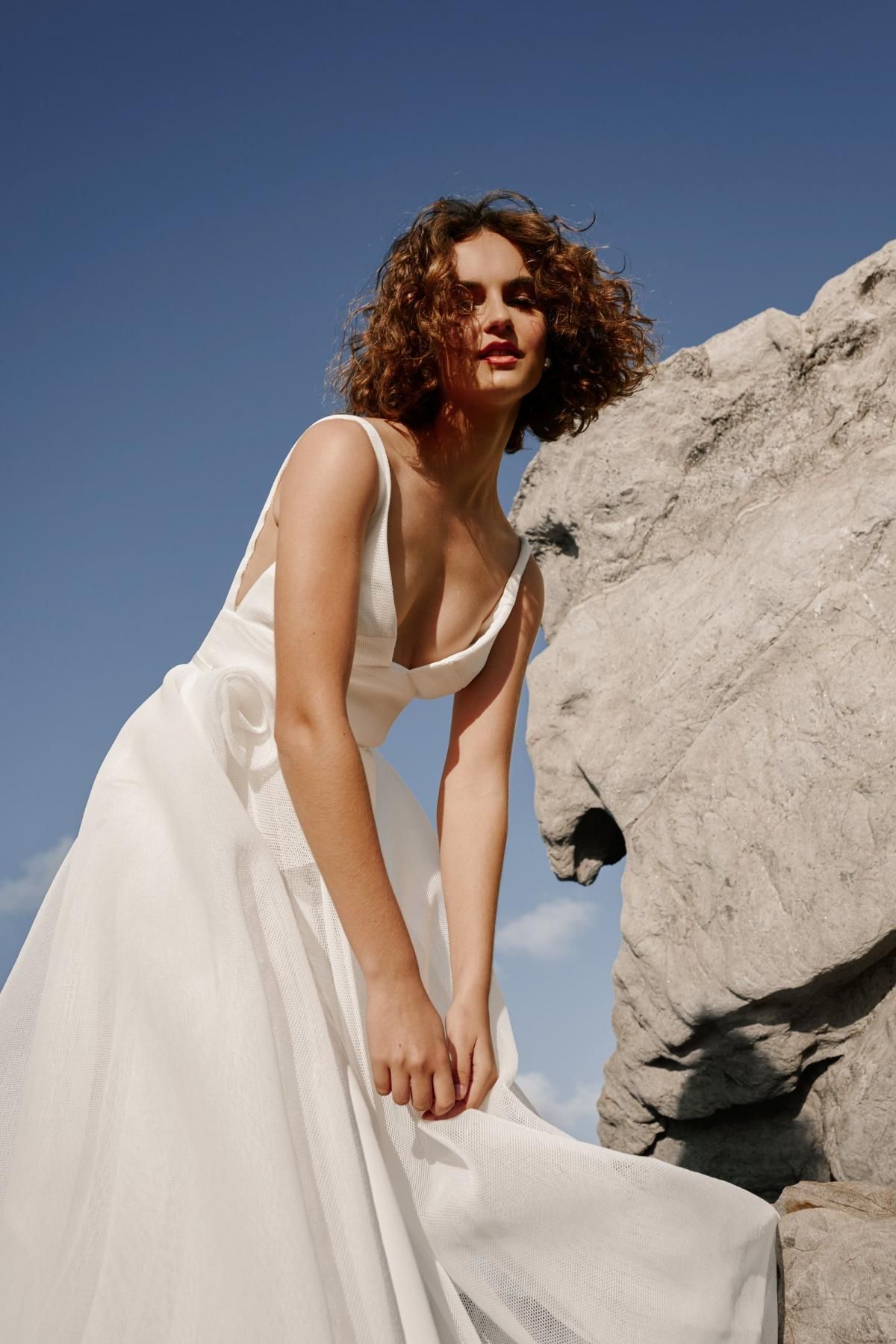 The Aisha gown by Karen Willis Holmes, v-neck wedding dress with rosette detail.