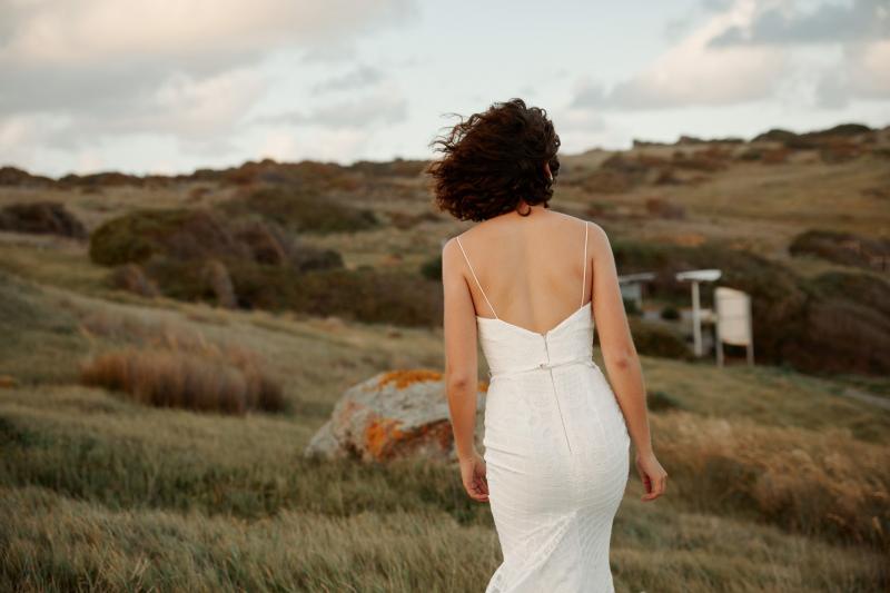 The Elodie gown by Karen Willis Holmes, a fit and flare sexy lace wedding dress with v-neck and modern feel.