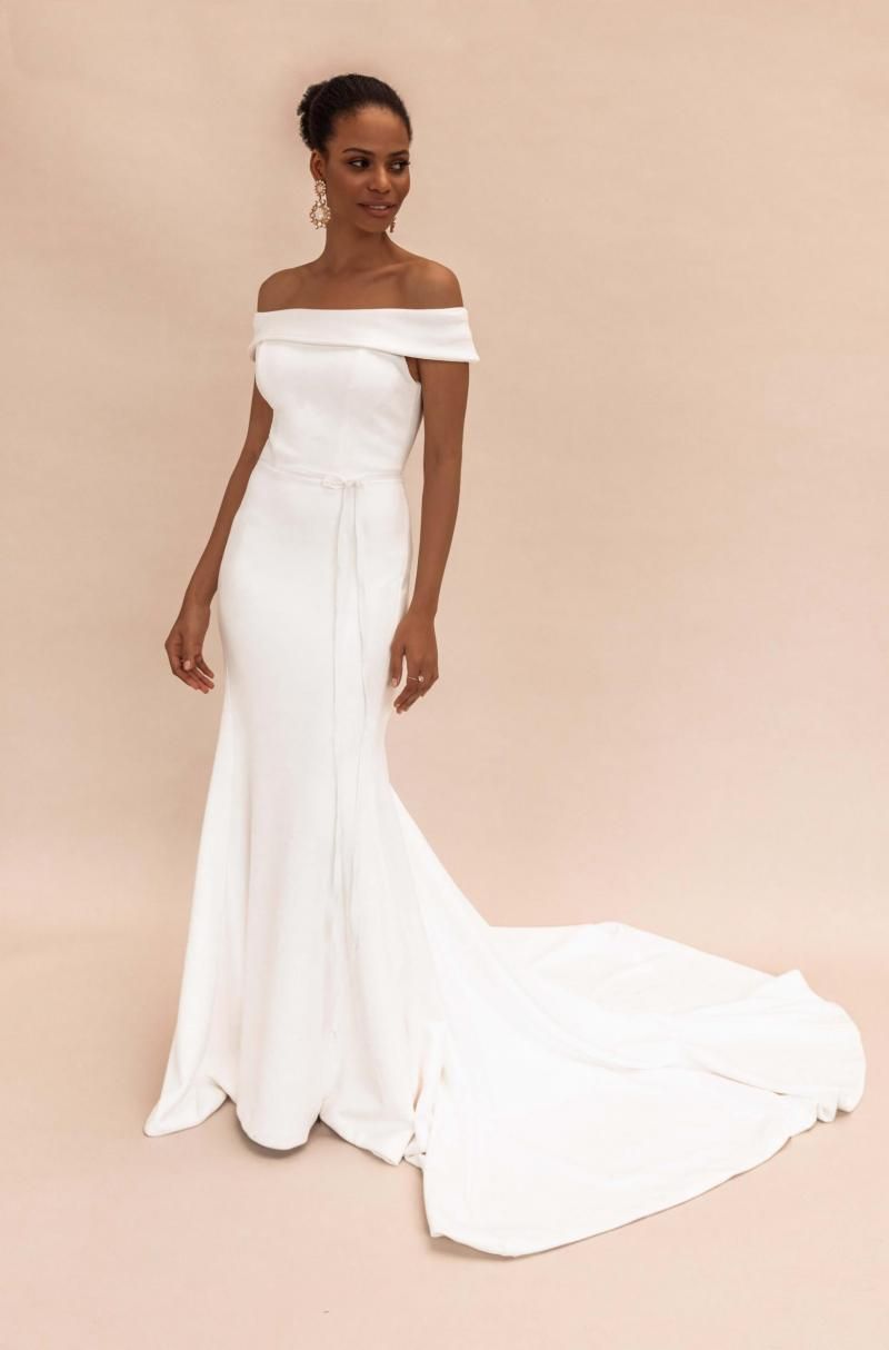 The Lauren gown by Karen Willis Holmes, simple off the shoulder fit and flare wedding dress.