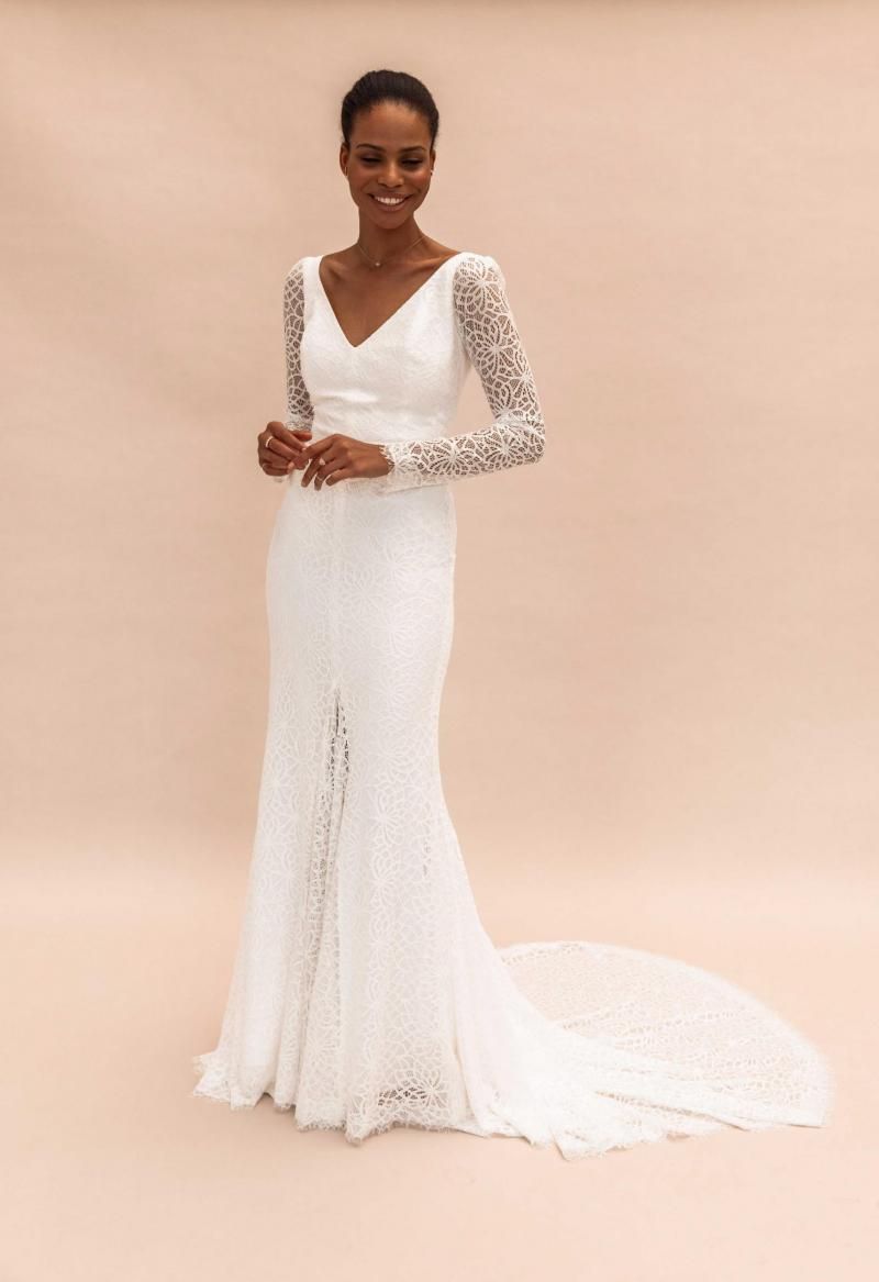 The Rylie gown by Karen Willis Holmes, v-neck long sleeve lace wedding dress with slit.