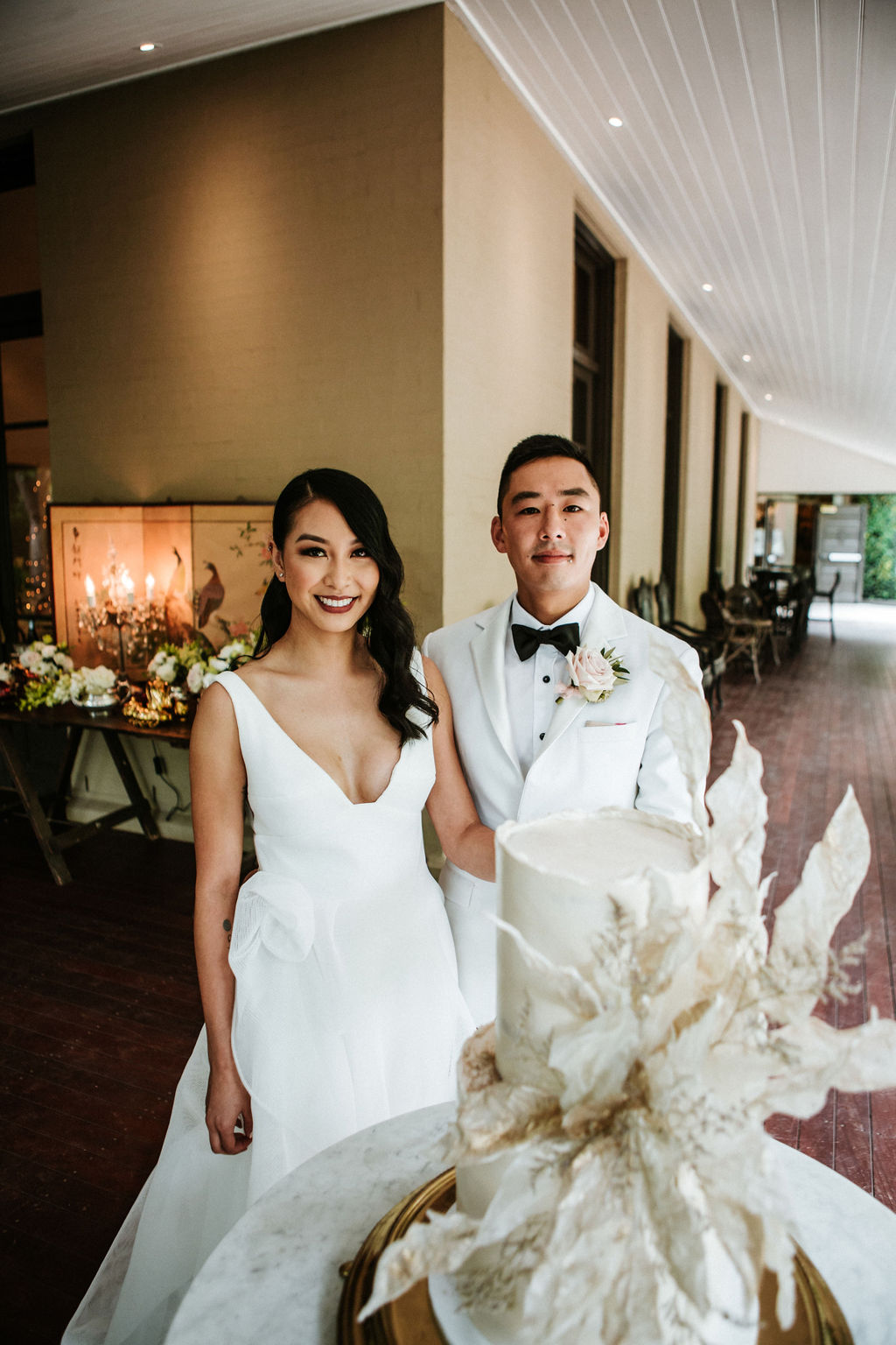 KWH bride Win wears the Modern A-line Aisha gown by Karen Willis Holmes, a non-traditional wedding dress with exotic cake.