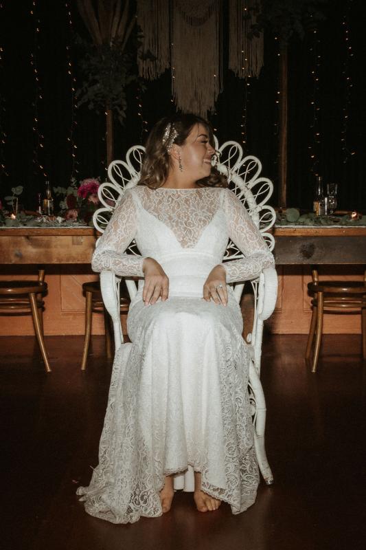 Karen Willis Holmes bride Meagan wearing the Karina gown to her real pub wedding reception; a long-sleeve lace wedding dress from the Wild Hearts Collection.