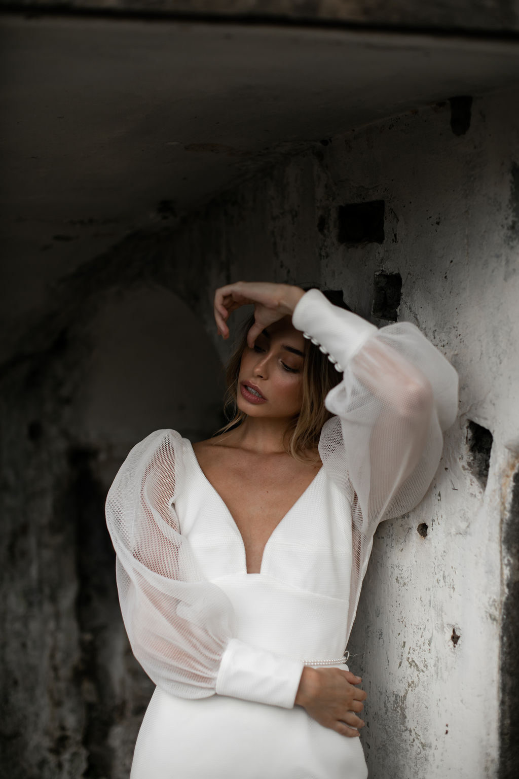 The Penelope wedding dress by Karen Willis Holmes, a modern take on a classic fit and flare wedding dress with customizable sleeves