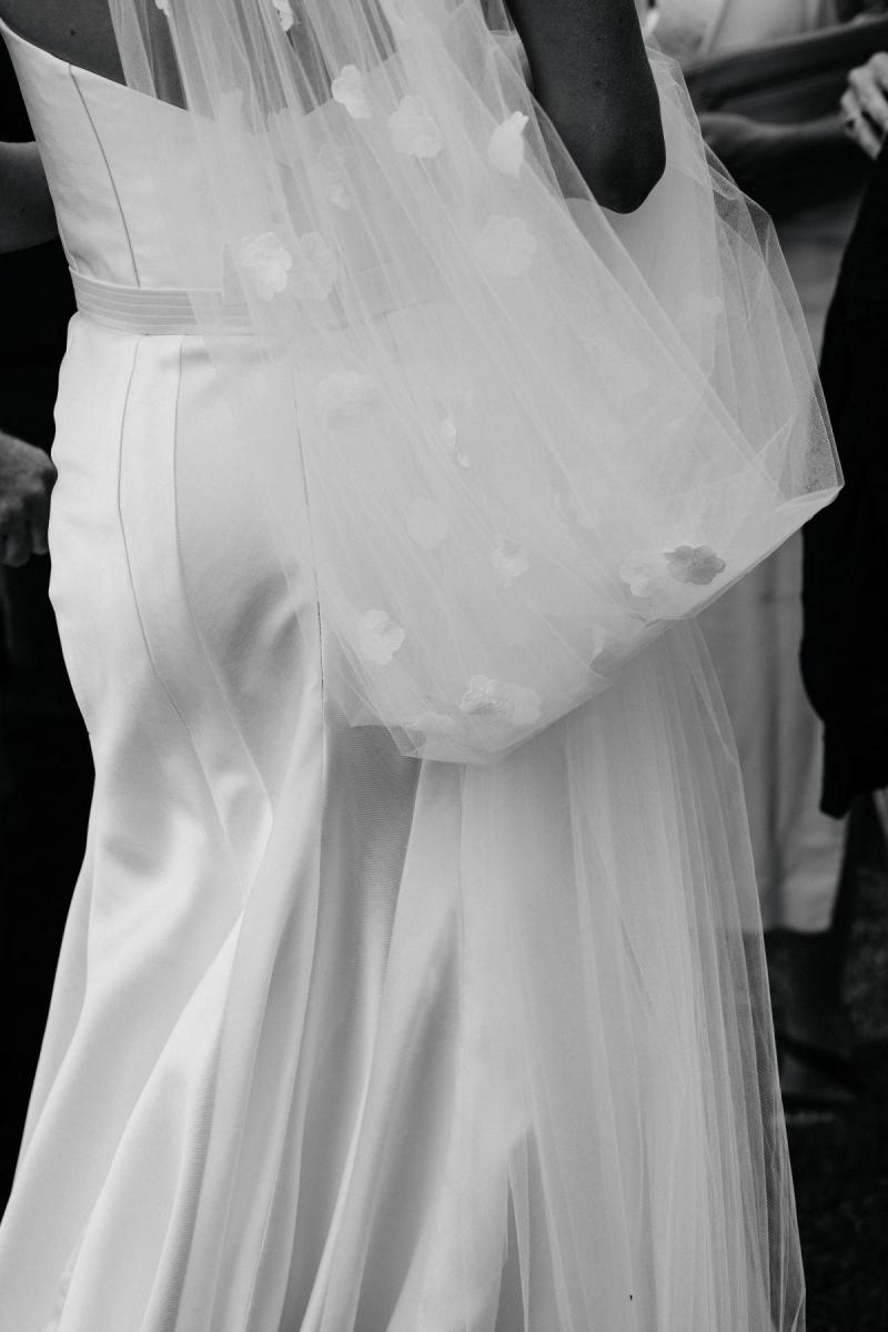 Close up of bride wearing Karen Willis Holmes Blake Prea wedding dress with detailed veil