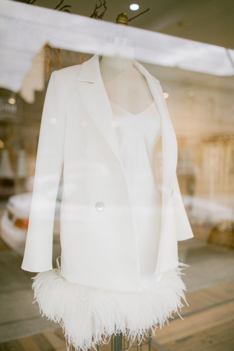 Mannequin wearing bridal suit jacket and silk slip mini dress at Karen Willis Holmes