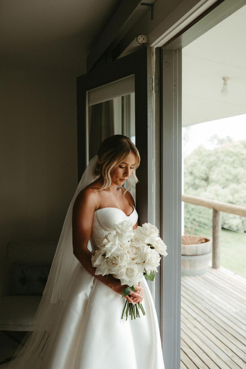 Real bride Brennah wears the Bespoke Blake Camille wedding dress; featuring a sweetheart neckline and traditional skirt by Karen Willis Holmes.