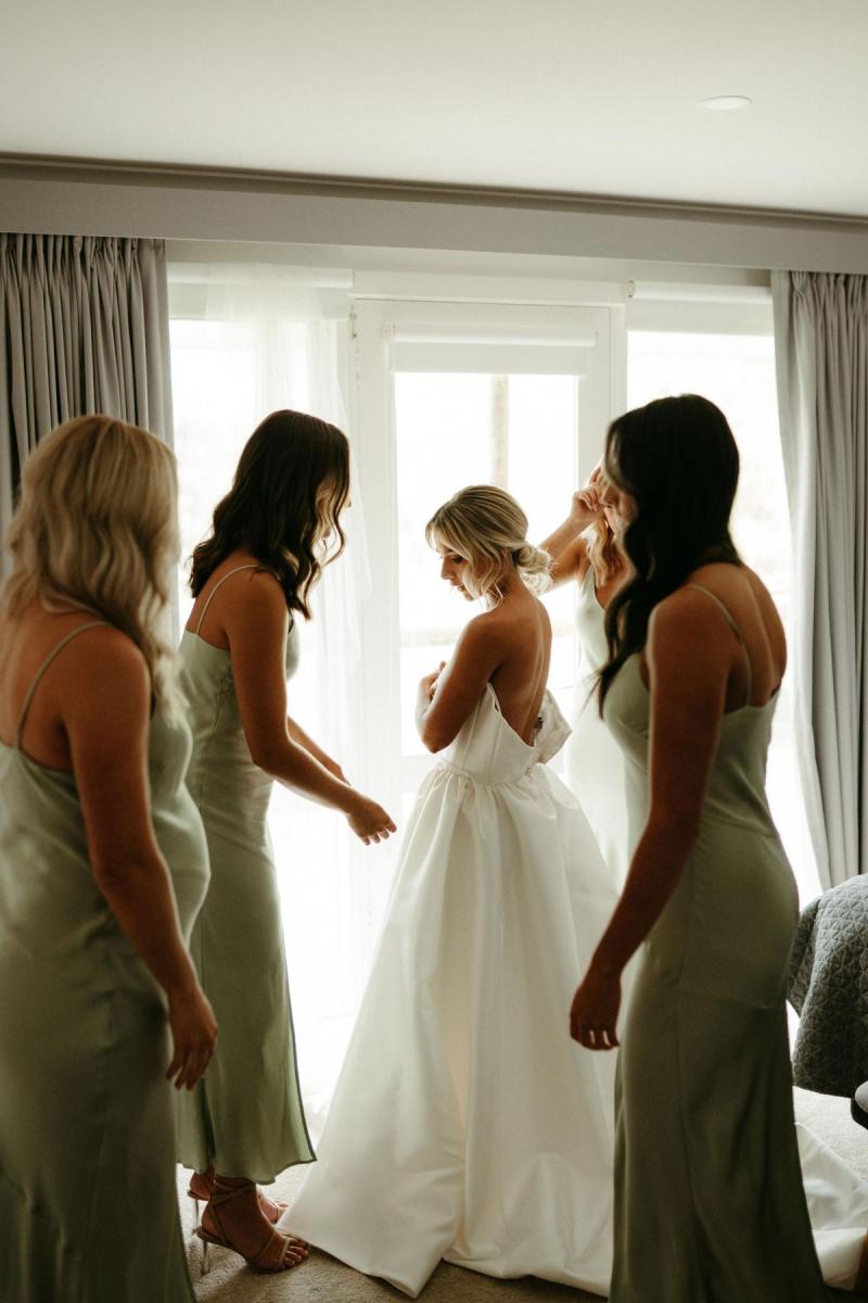 Real bride Brennah wears the Bespoke Blake Camille wedding dress; getting ready with her bridesmaids.