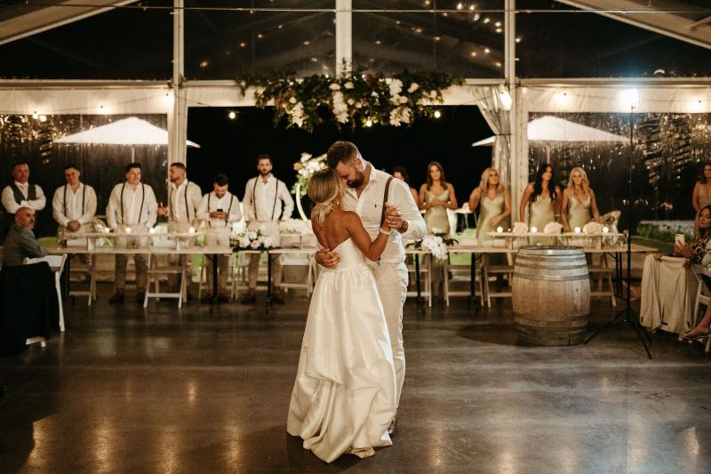 Real bride Brennah and new husband having their first dance, wearing the Blake Camille by Karen Willis Holmes.