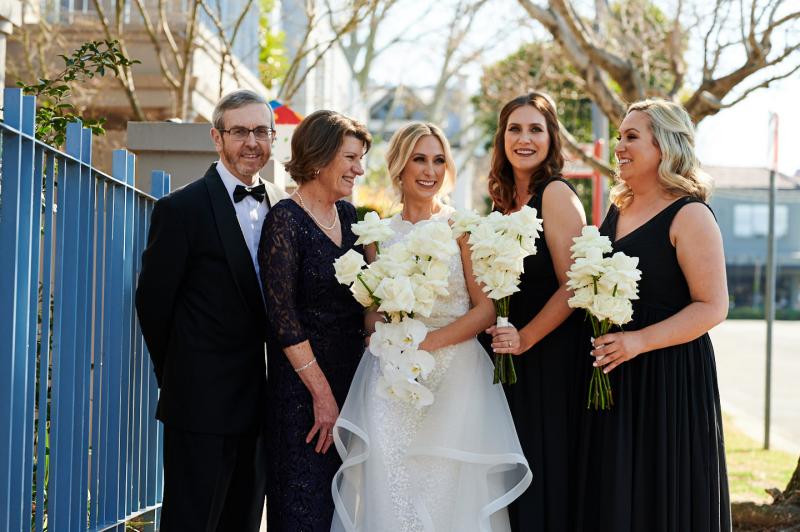Real bride Claire with her family at Sydney wedding, wearing the Cindy gown by Karen Willis Holmes.