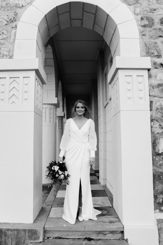 Real bride Shannon wears the long sleeve Nikki gown, a timeless wedding dress by Karen Willis Holmes.