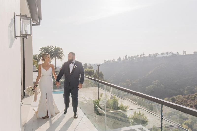 Real bride Noel wears the Caroline gown; a simple v-neck wedding dress from the Wild Hearts collection by Karen Willis Holmes to her intimate LA wedding.
