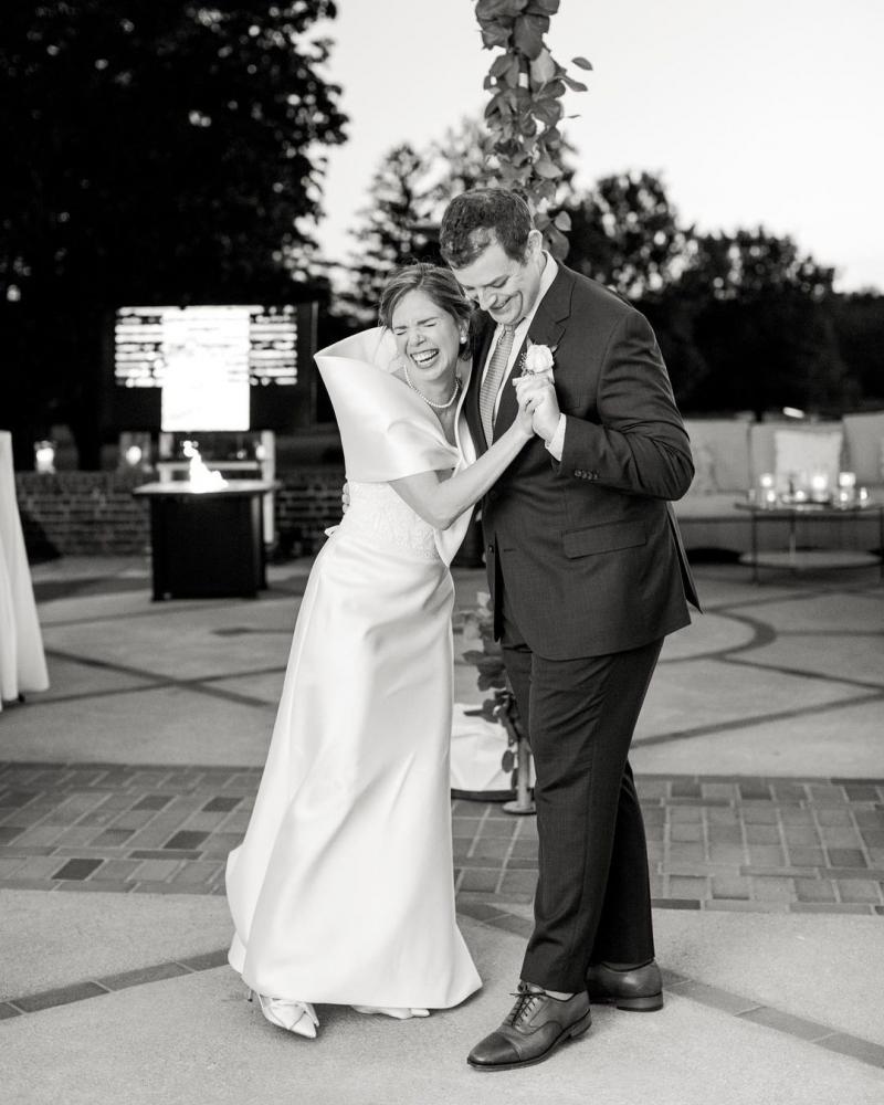 Real bride Hailey with her husband at small wedding ceremony, wearing the Demi Karly gown by Karen Willis Holmes.