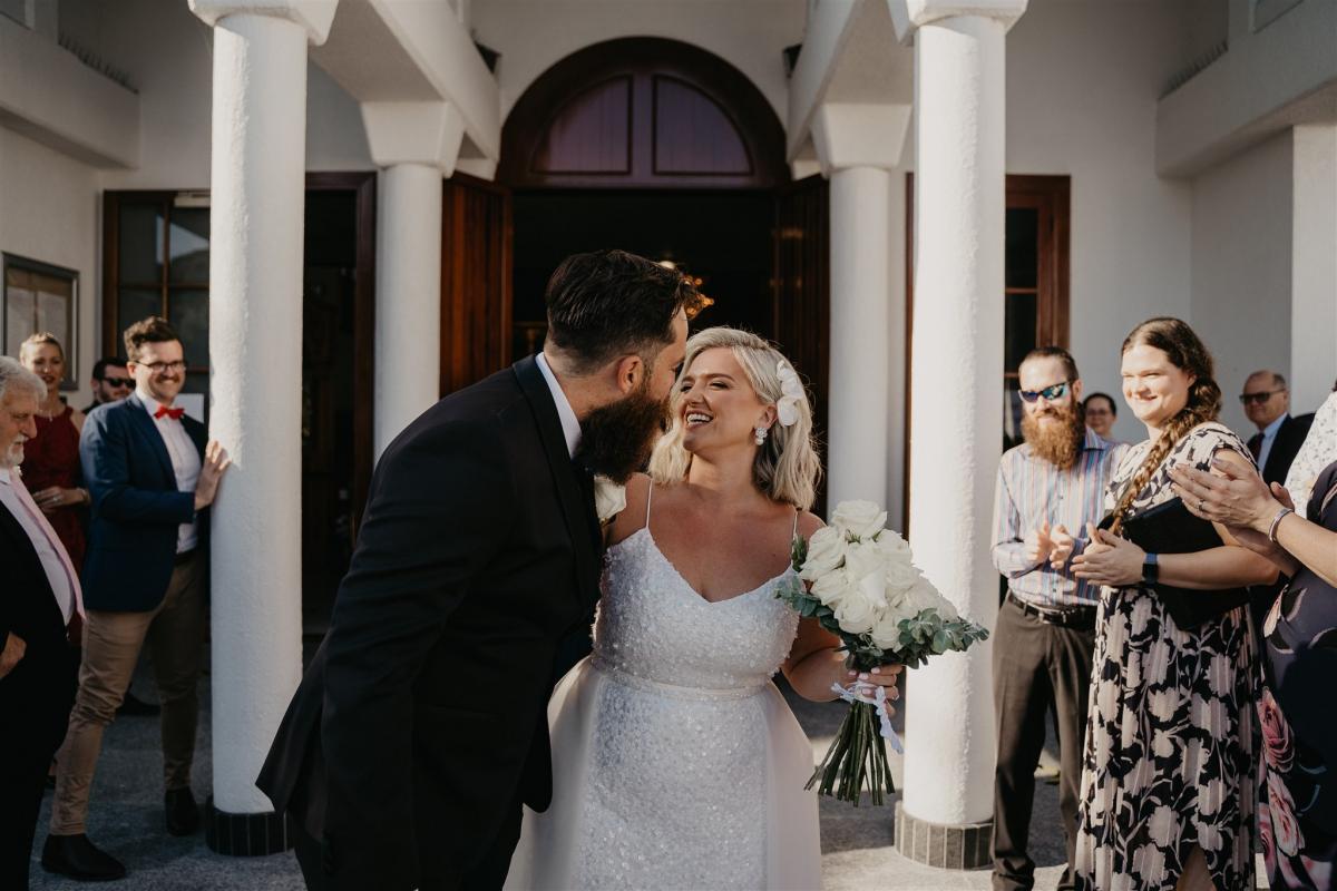 Real bride Leanne wears the Anya gown by Karen Willis Holmes to small church wedding ceremony.
