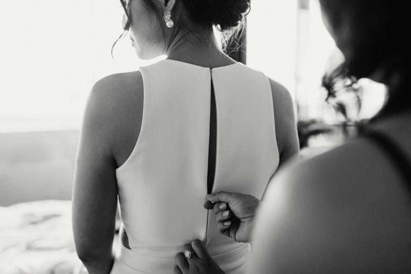 Real bride Melissa getting ready for her small covid wedding, wearing the Bridget gown by Karen Willis Holmes.