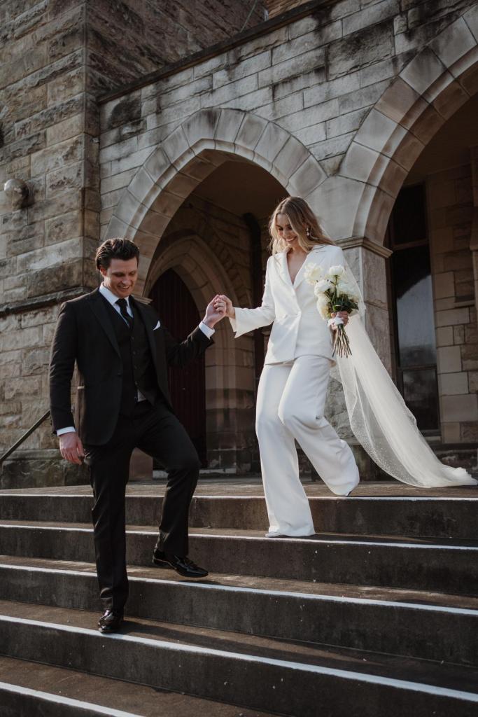 Demi Bryant wears the Charlie Danielle suit by aren Willis holmes to her sydney elopement