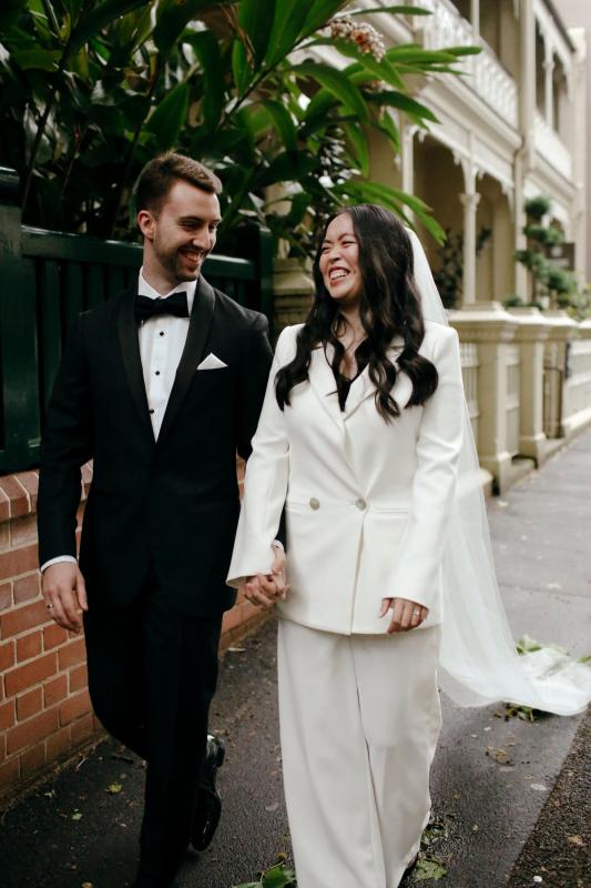 Real bride Nicole elopes wearing the Charlie Danielle; a tailored bridal suit by Karen Willis Holmes.