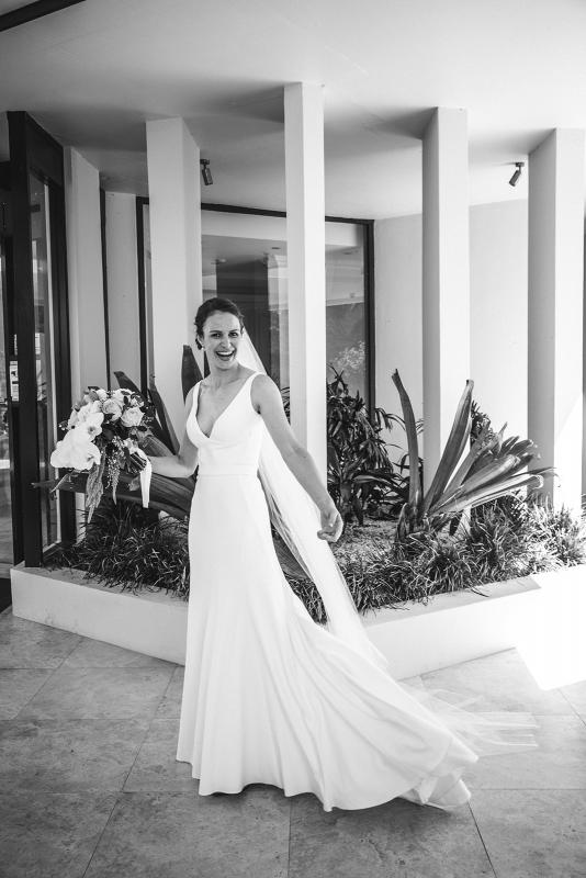 Real bride Joan wears the Imogen gown on her Sydney wedding day, a chic simple v-neck wedding dress designed by Karen Willis Holmes.