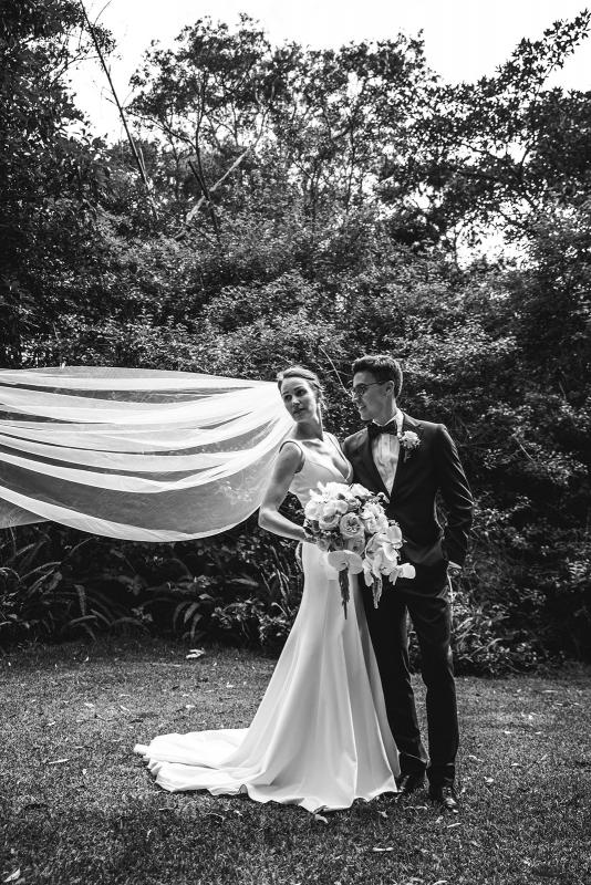 Real bride Joan wears the Imogen gown oner her Sydney wedding day, a chic simple v-neck wedding dress designed by Karen Willis Holmes with dramatic veil.