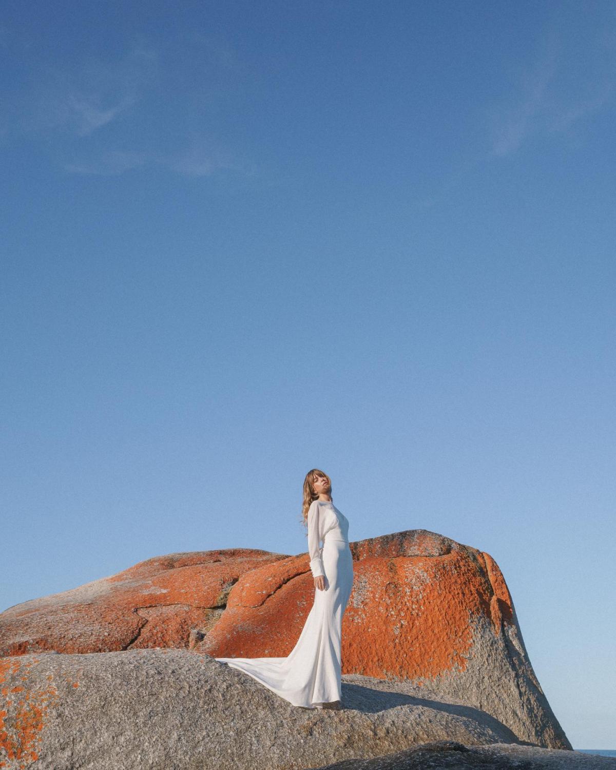 Brie, an elegant wedding dress with sheer long sleeves by Karen Willis Holmes on Byron bay model Christina Macpherson