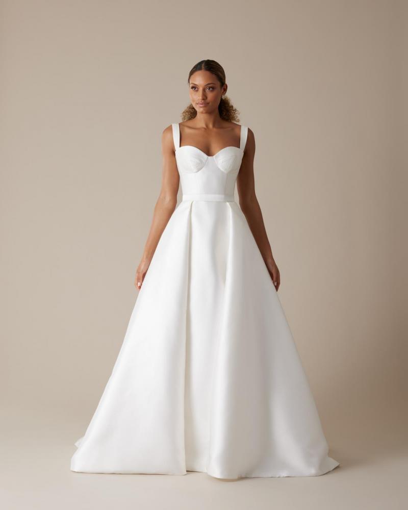 The Blake bodice by Karen Willis Holmes, a simple bustier wedding dress bodice with straps and paired with the aline Elizabeth skirt.