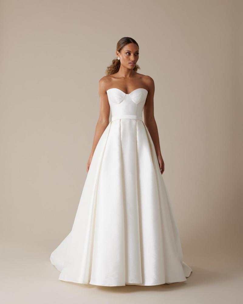 The Blake bodice by Karen Willis Holmes, a simple bustier wedding dress bodice paired with the pleated Melanie skirt.