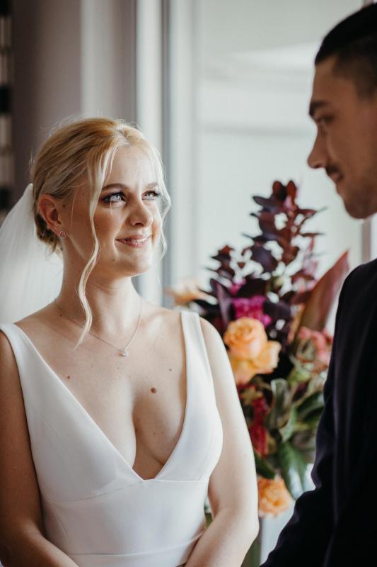 KWH real bride Eliza gazes at her soon to be husband in this image showing off her deep v-neck of her Imogen gown.