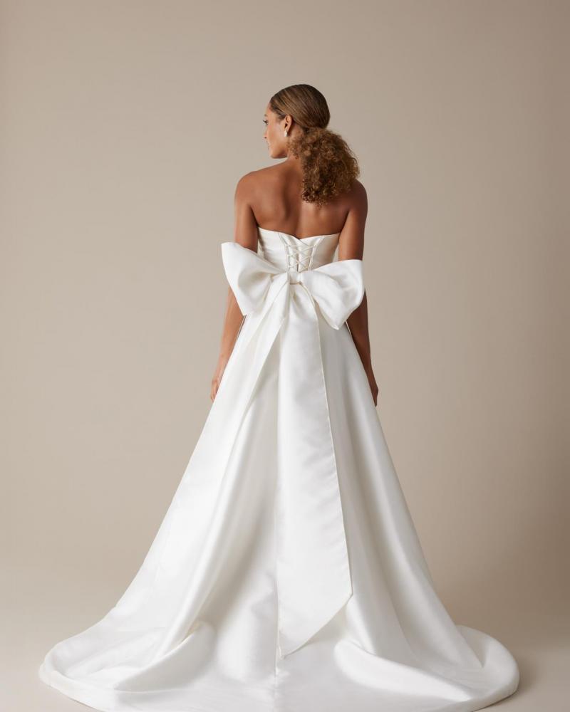 The Kitty bodice by Karen Willis Holmes, a simple strapless sweetheart wedding dress bodice with a giant twill bow on the back