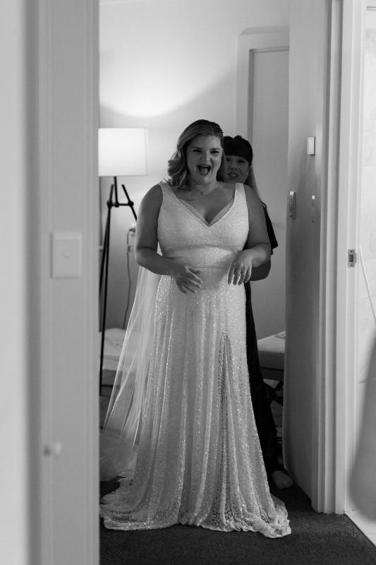 Real bride Annabel getting ready for her Sydney wedding, wearing the Lotus gown; a sequin a-line wedding dress by Karen Willis Holmes.
