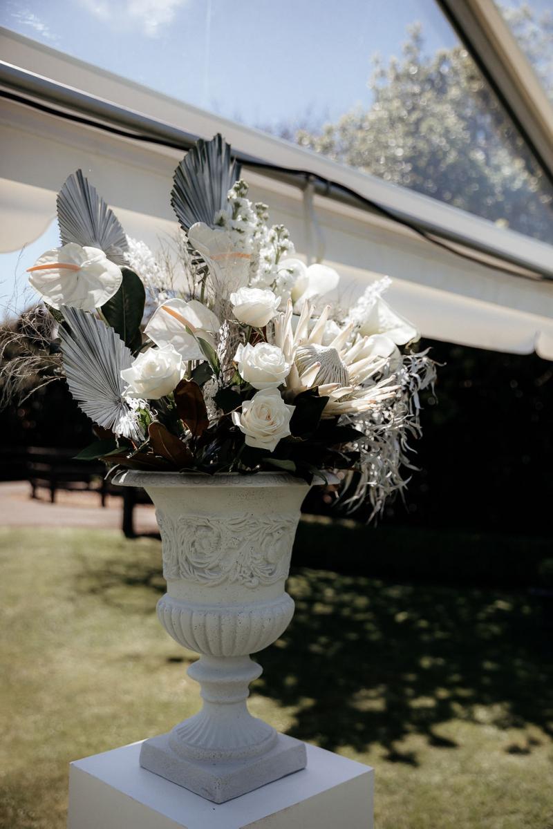 KWH real bride Hannah's ceremony floral arrangment by The Flower Folly.