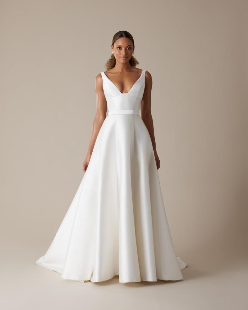 The Taryn bodice by Karen Willis Holmes, a simple, U-neckline wedding dress bodice with straps paired with the simple Nina skirt.