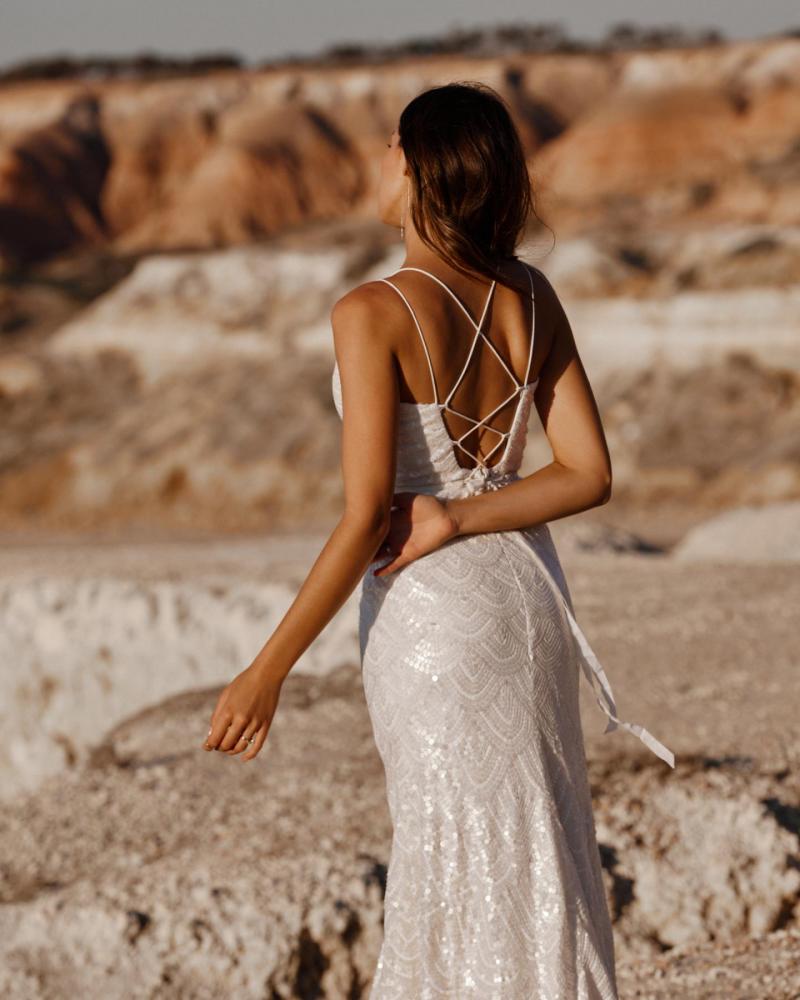 The Ellie gown by Karen Willis Holmes, a V-Neck open back, beaded fit and flare wedding dress.