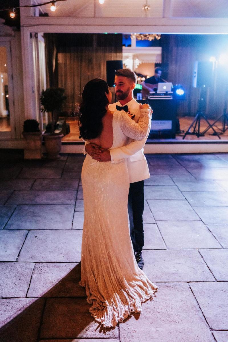 KWH real bride Katherine and Conor have their first dance. She wears the glamorous Margareta gown, a open back beaded wedding dress.