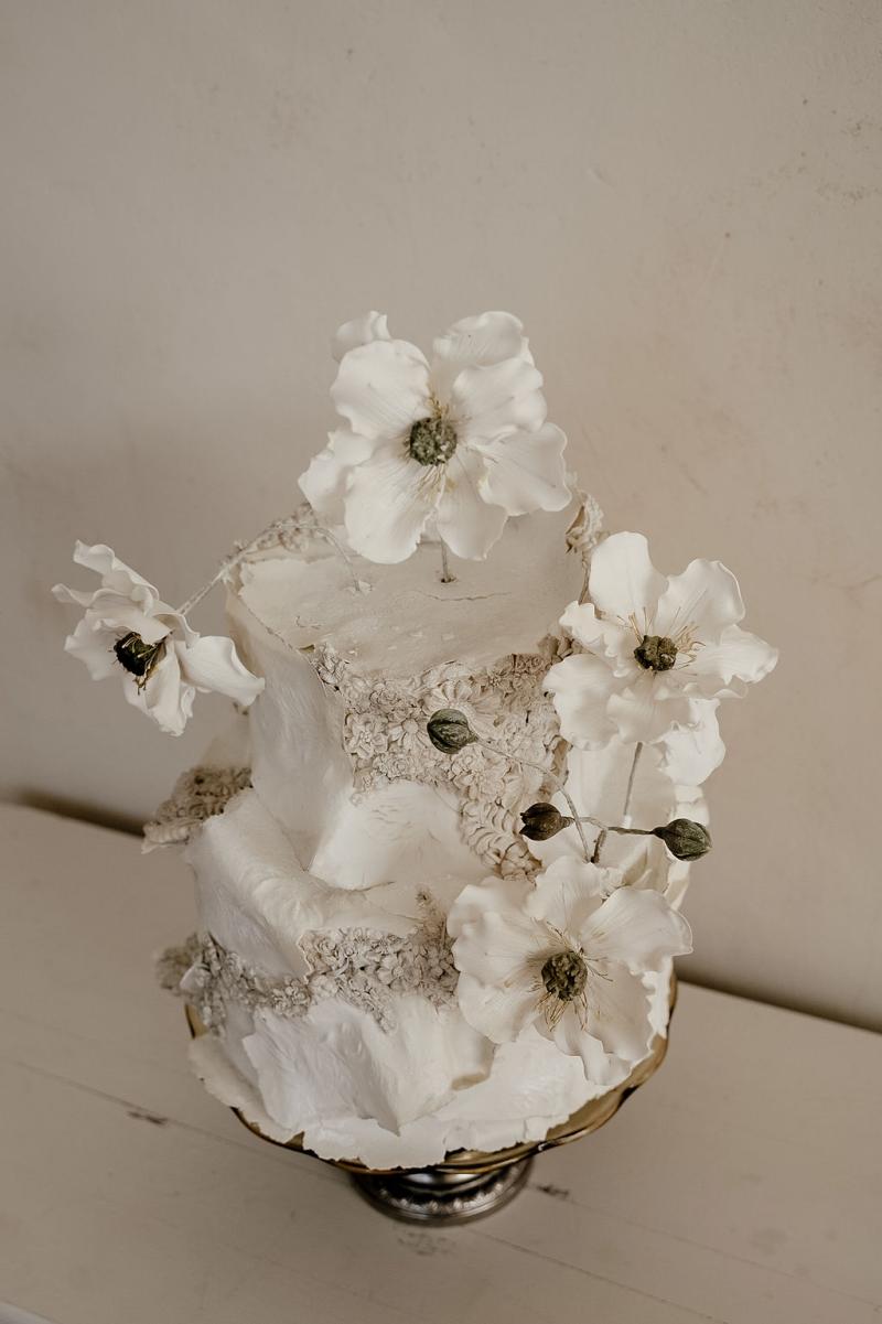 Wedding cake by Marina Machado at intimate reception at Deux Belettes in Byron Bay