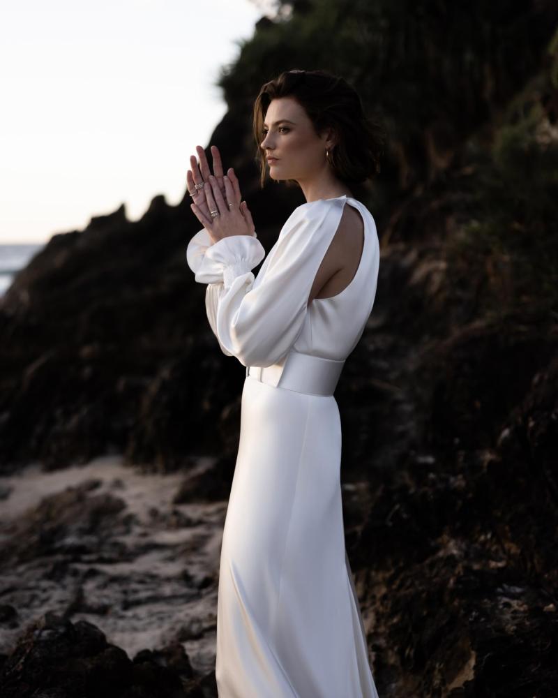 The Enya gown by Karen Willis Holmes, a simple, high neck fit and flare silk satin wedding dress.