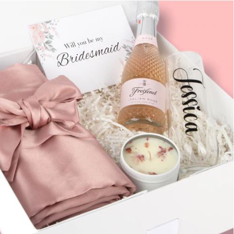 Bridesmaid proposal box hamper by Bride Tribe with robe champagne candles personalised cup and bridesmaid proposal card