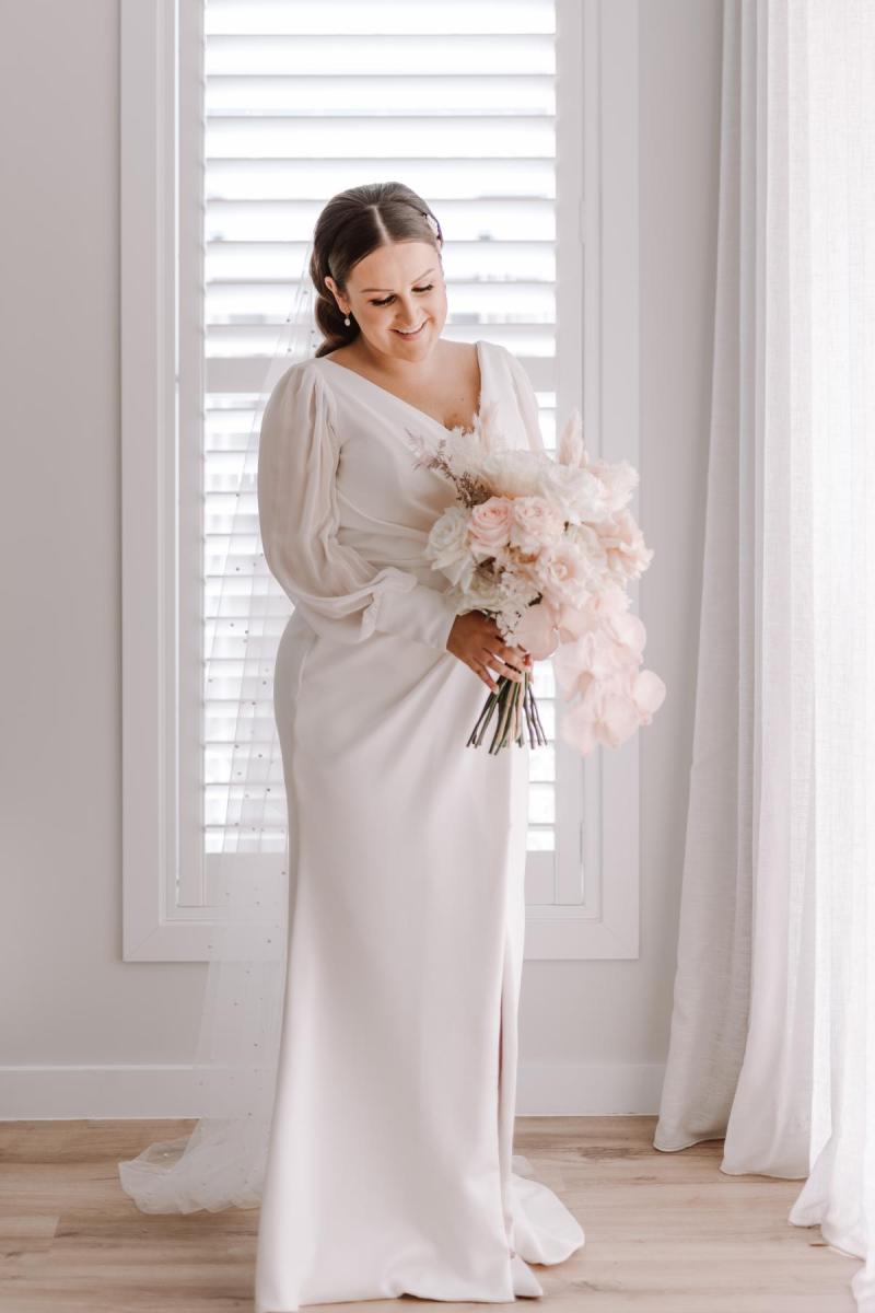 Nikki-Karen Willis Holmes-Tayla & Daniel-Nikki is the perfect way to make a unique statement with a timeless look. She’s one of those special gowns that can take on the persona of whoever is wearing her and she’s perfect for any style wedding; sophisticated and elegant, or a more relaxed causal feel.