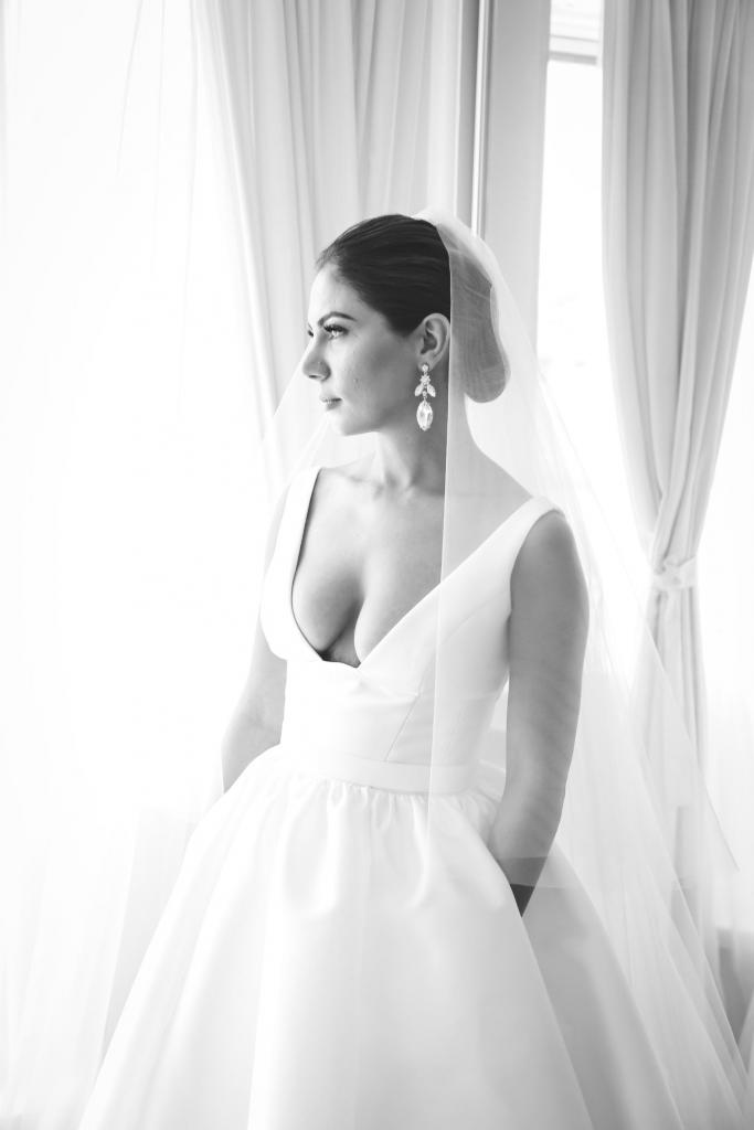 Real bride Lina wore the Bespoke Taryn Camille wedding dress by Karen Willis Holmes.