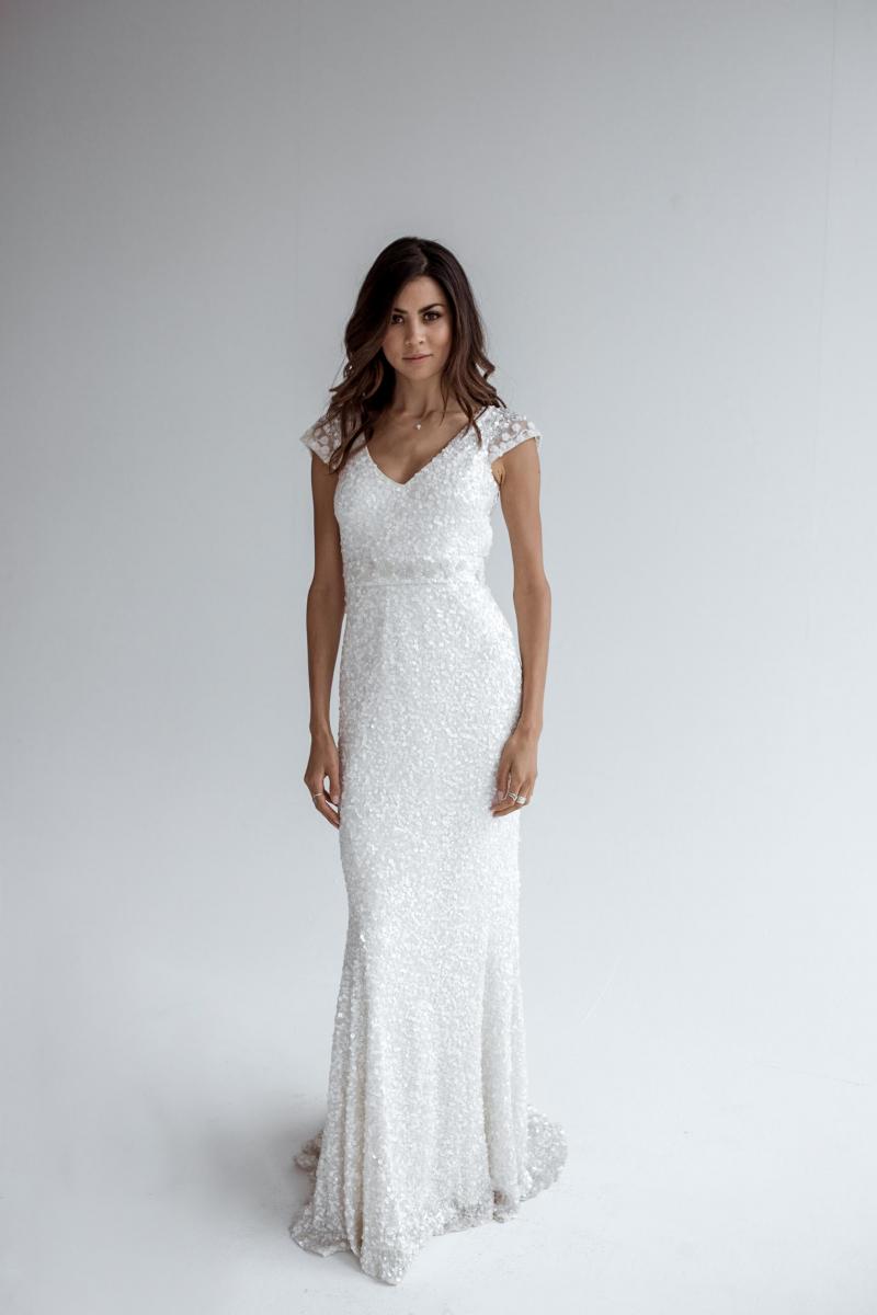 The Caitlyn gown by Karen Willis Holmes, V-neck fit and flare vintage beaded wedding dress.