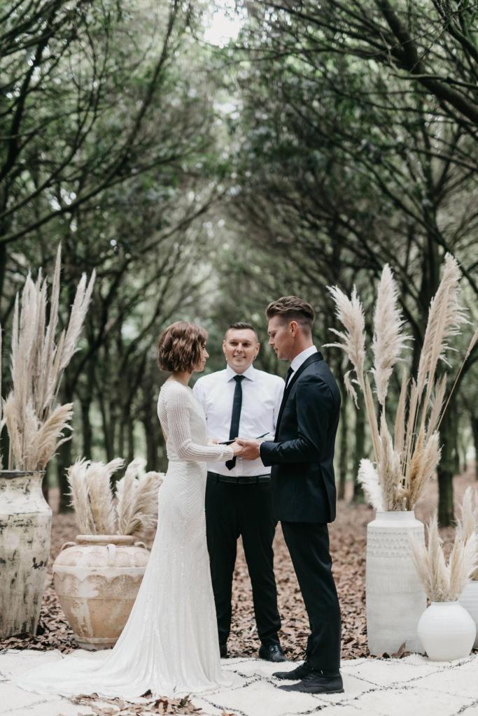 Real bride Taylor wore the Luxe Cassie wedding dress by Karen Willis Holmes.