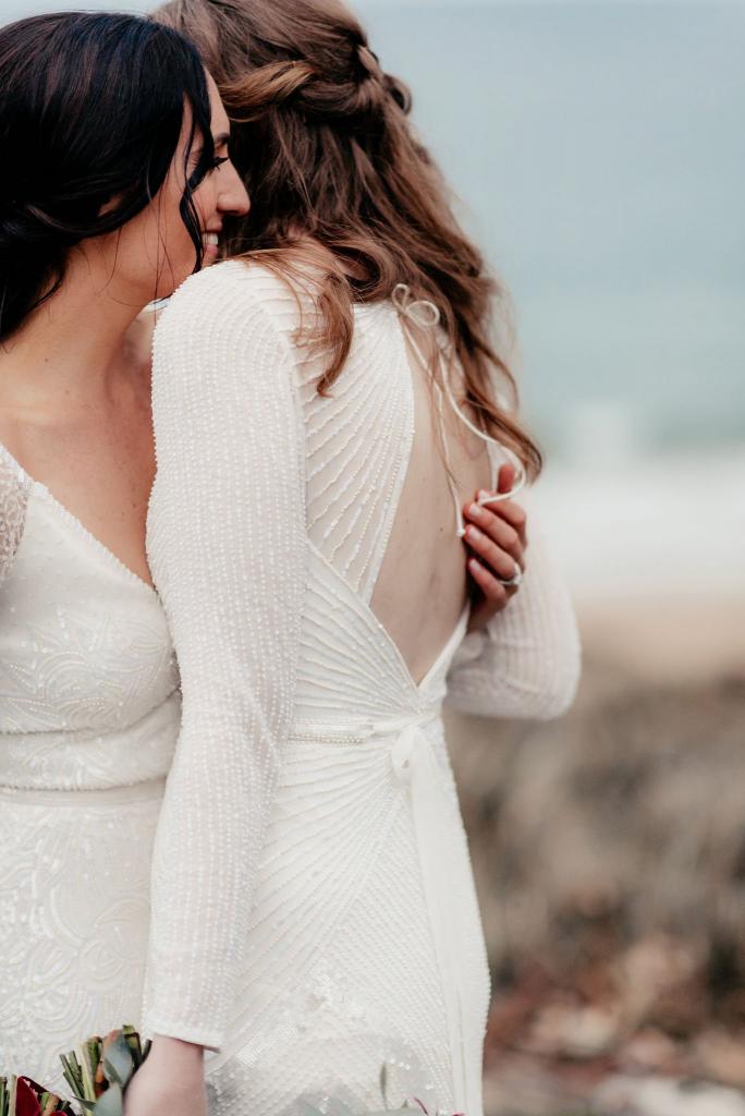 Real brides Elle & Carina wore the Luxe Celine & Cassie wedding dresses by Karen Willis Holmes.