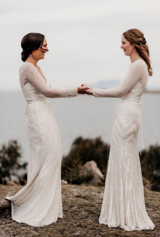 Real brides Elle & Carina wore the Luxe Celine & Cassie wedding dresses by Karen Willis Holmes.