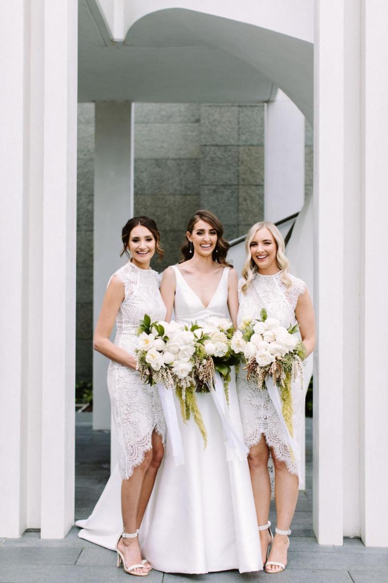 Real bride Courtney wore the Bespoke Leonie/Camille wedding dress by Karen Willis Holmes.