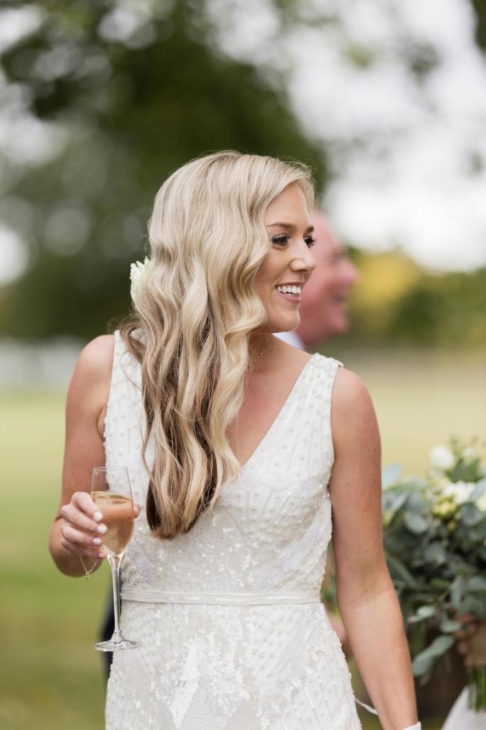 Real bride Karli wore the Luxe Fontanne wedding dress by Karen Willis Holmes.