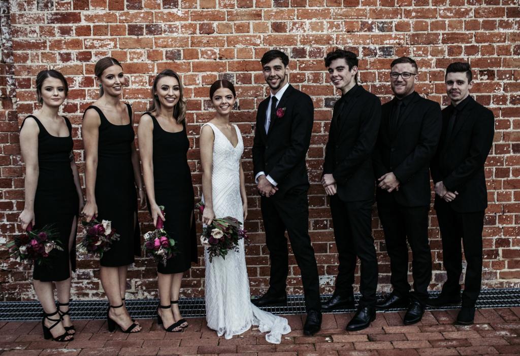 Real bride Victoria wore the Luxe Whitney wedding dress by Karen Willis Holmes.